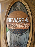 Beware of the Wigglebutts Welcome Sign